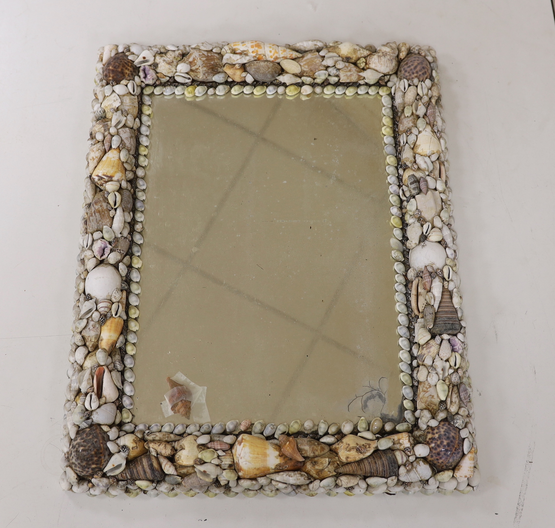 A shellwork framed wall mirror, 63x50cm